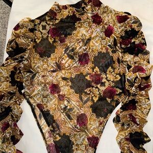 Turtle neck ruffle sleeve mesh bodysuit.